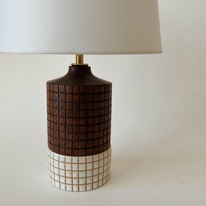 Natural wood table lamp with a textured geometric design, showcasing impressive woodworking craftsmanship.