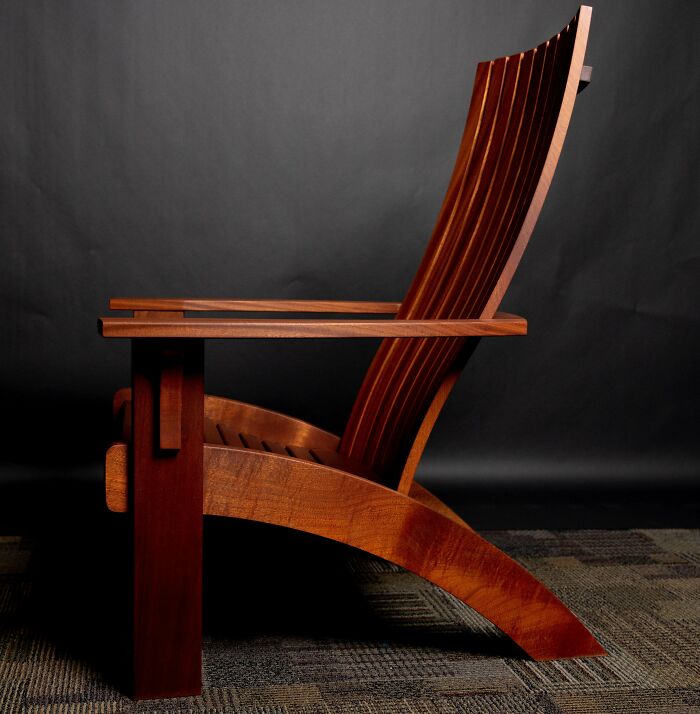 Elegant wooden chair showcasing impressive woodworking craftsmanship.