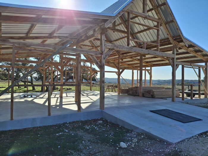 Open wooden frame structure under construction, showcasing impressive woodworking projects.