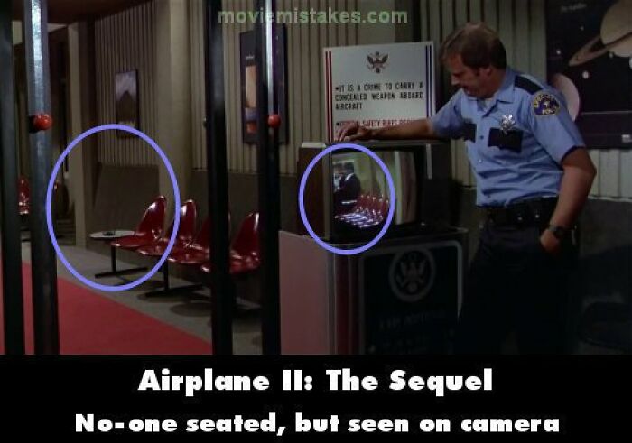 Security guard pointing at a screen showing a continuity error with empty chairs in "Airplane II: The Sequel".