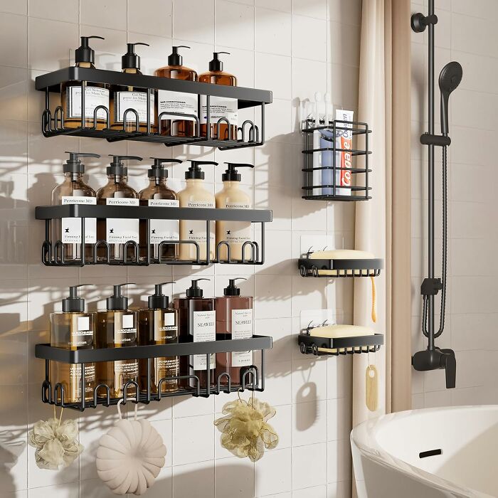 "Shower with organized racks holding toiletries, embodying Less-Mess-2025 principles for a tidy bathroom space."