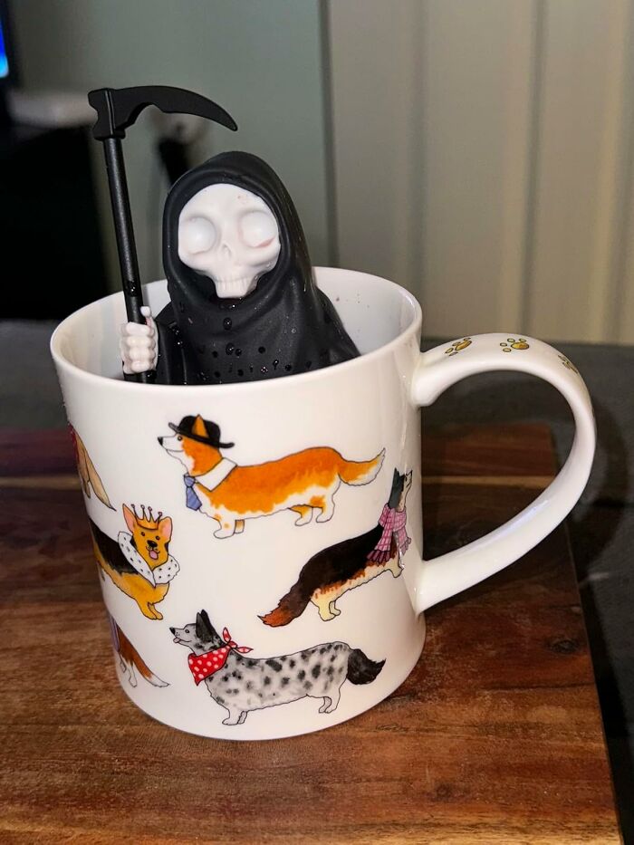 Weirdest gifts: a Grim Reaper figurine in a dog-patterned mug.