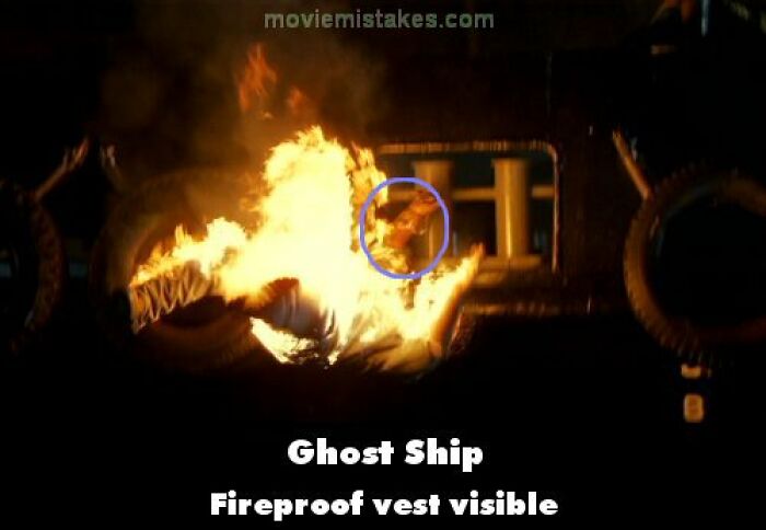 Fireproof vest visible in burning scene from Ghost Ship, illustrating funny movie mistakes.