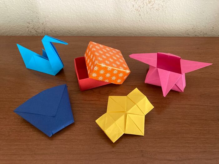 Colorful origami on a wooden table showcasing new hobbies in 2025.