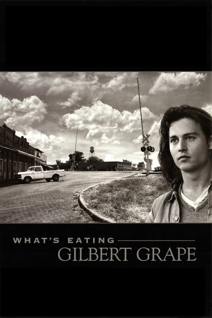 Black and white poster of "What's Eating Gilbert Grape" featuring a scenic town street and a man with long hair. Best Nostalgia Movies.