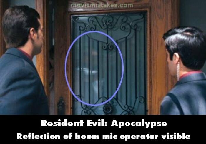 Reflection of boom mic operator seen in a door window, capturing a funny movie mistake.