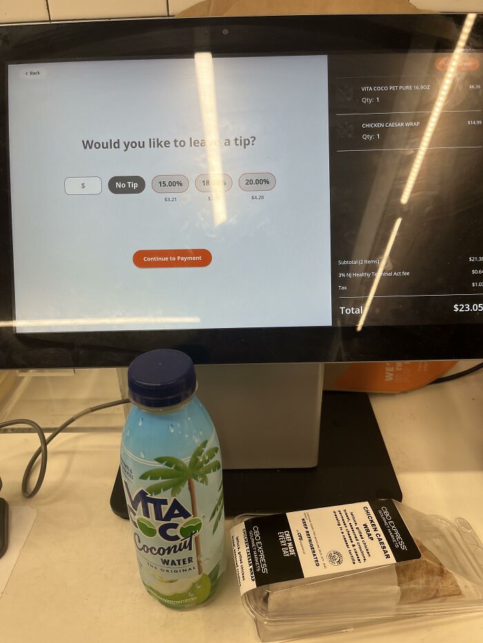 Checkout screen with tipping options, protein bar, and Vita Coco beverage, highlighting normalized social norms.