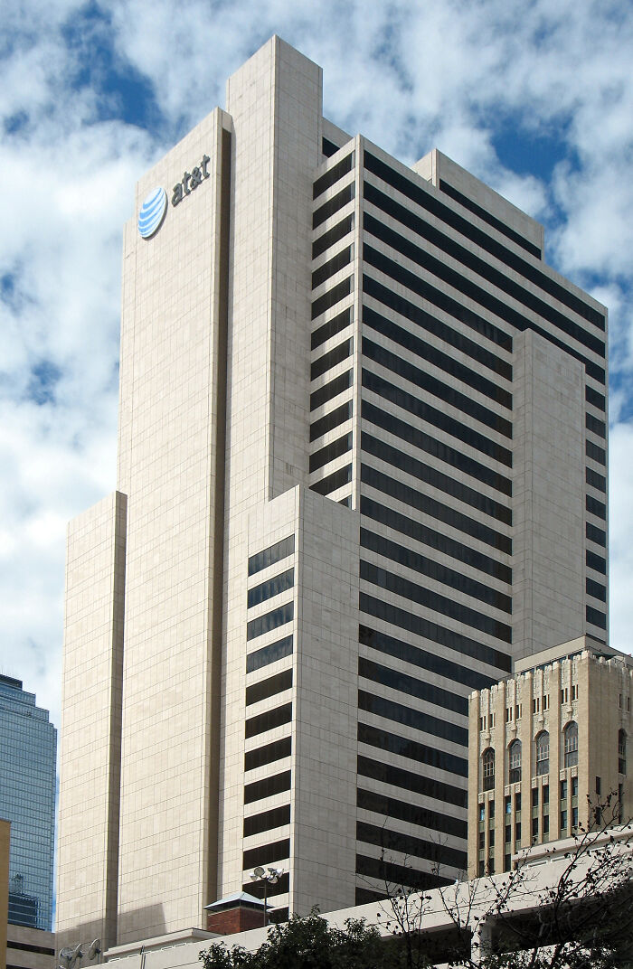 Tall AT&T corporate building under a blue sky; intriguing architecture fact.