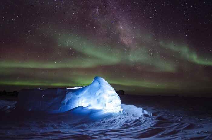 Ice formation under the stunning Northern Lights, showcasing incredible and strange natural phenomena at night.