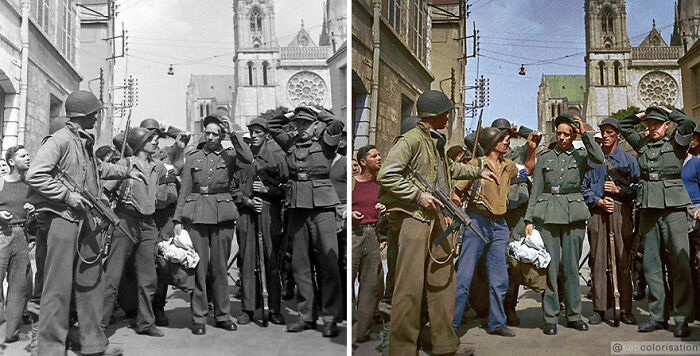 Colorized vintage photo by Sebastien De Oliveira showing soldiers and civilians in a historical street scene.