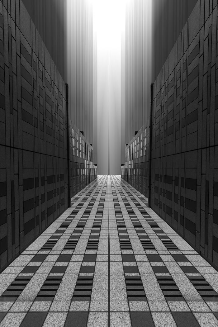 Symmetrical black and white architectural scene, showcasing a pathway between towering buildings.