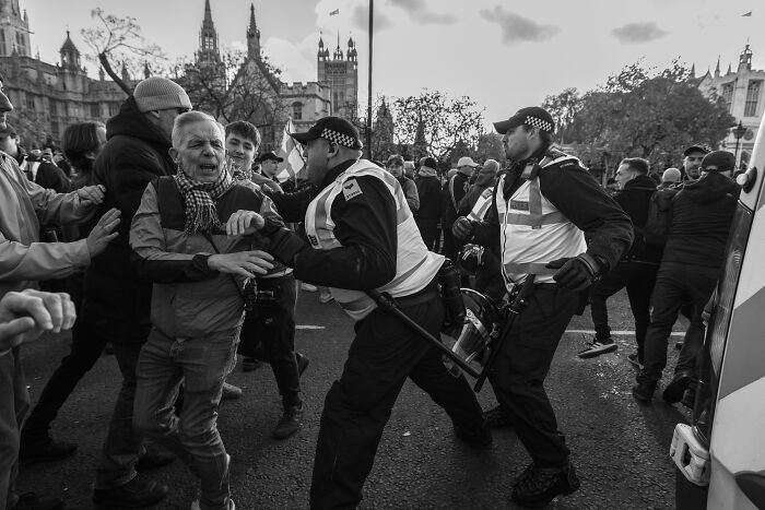 Crowd and police interaction during Budapest International Foto Awards-winning photograph.