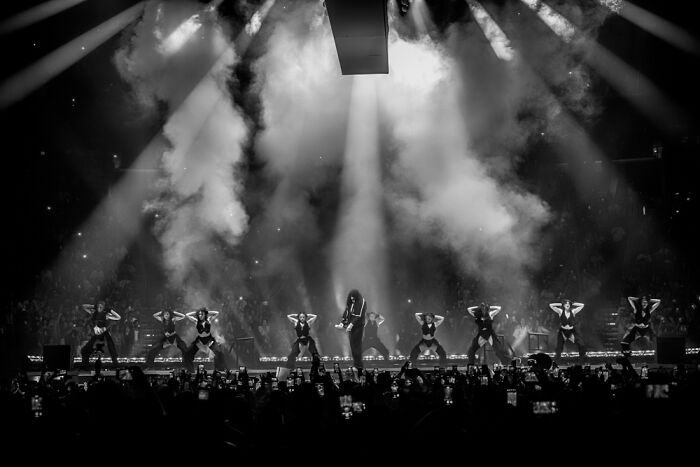 Performance captured at Budapest International Foto Awards 2024, featuring dancers in a dramatic, smoke-filled setting.