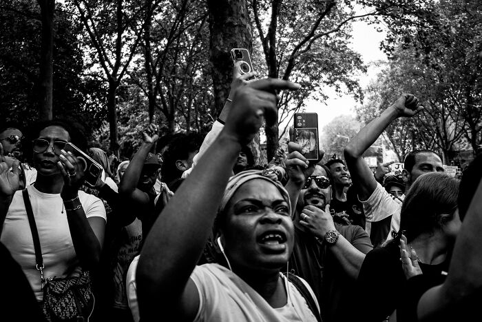 Black and white photo of a lively crowd.