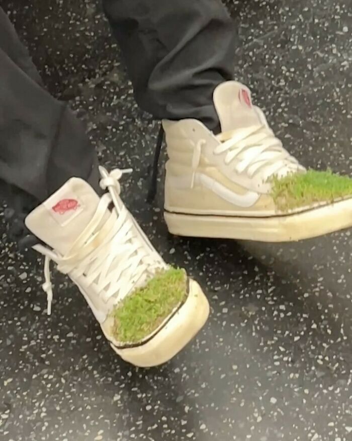 Unique New York fashion: Sneakers adorned with green moss, worn by a NYC local, showcasing creative style experimentation.