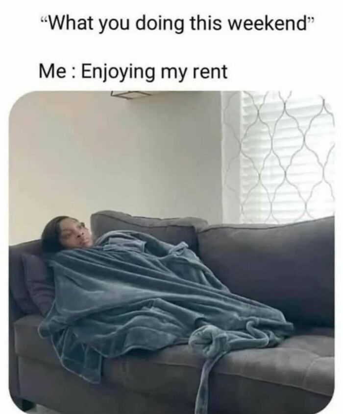 Woman humor meme featuring a person on a couch wrapped in a blanket, captioned “What you doing this weekend? Me: Enjoying my rent.”