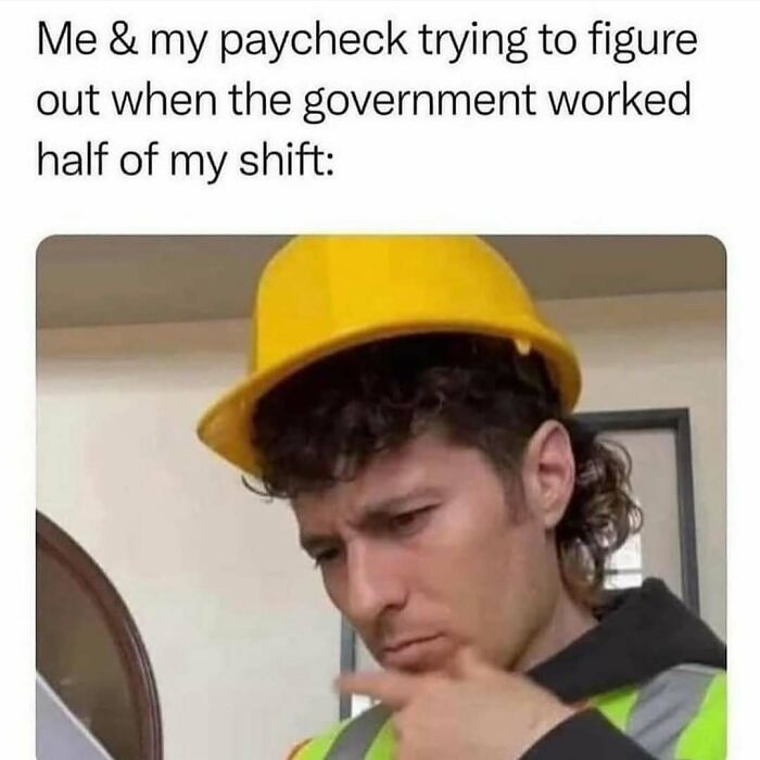 Man in a hard hat looking puzzled with funny text about paychecks