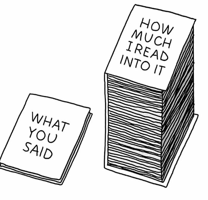 Two stacks of paper labeled "What You Said" and "How Much I Read Into It," illustrating introvert meme humor.