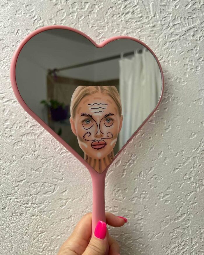 Hilarious-Kids: Child's face with funny drawings reflected in a heart-shaped mirror.