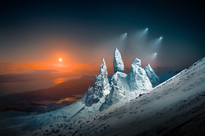 Snowy peaks under a colorful sunset with bright stars in the sky, representing an award-winning photo at the Tokyo Foto Awards.