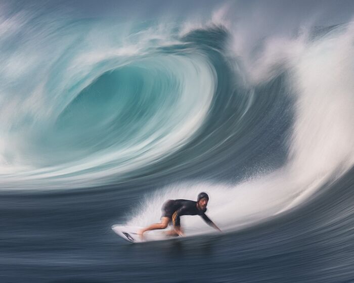 Surfer riding a huge wave.