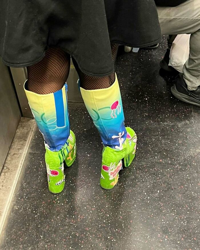 Colorful and artistic boots worn by a New Yorker, showcasing unique fashion style and creative expression.