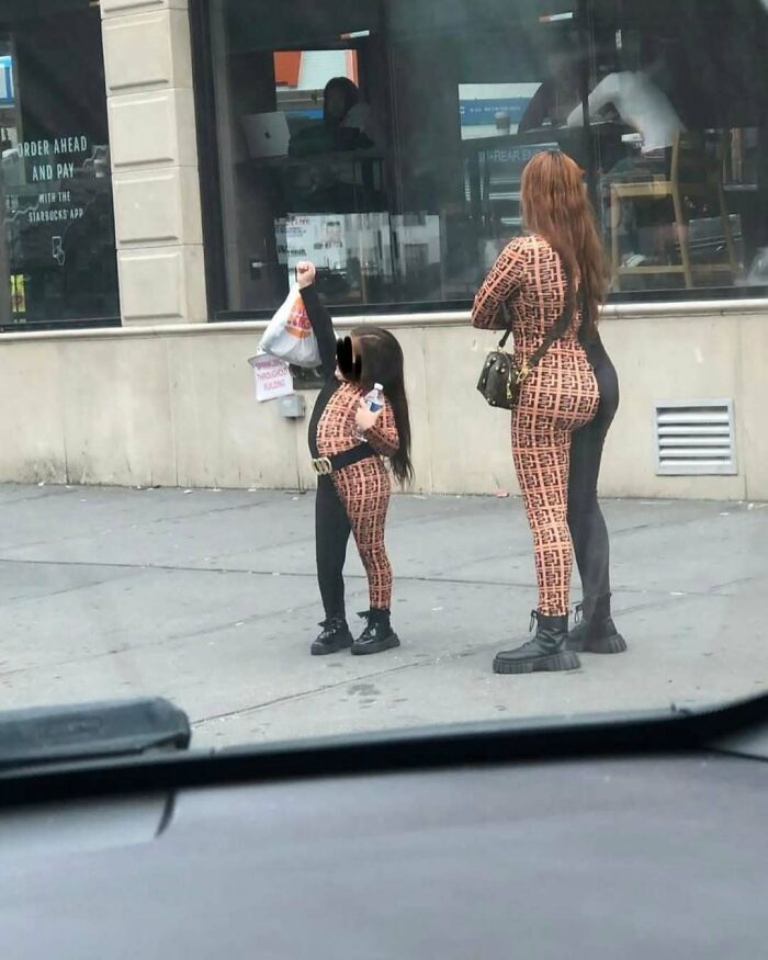 NYC locals in matching patterned outfits, showcasing bold fashion on the street.