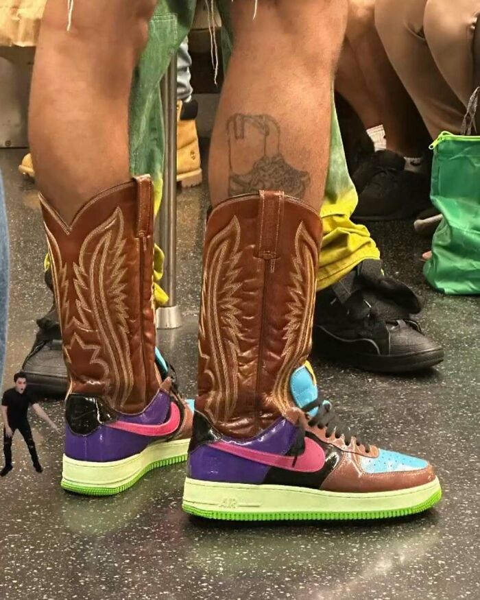 NYC local wearing unique cowboy boots over colorful sneakers, showcasing experimental fashion on public transport.