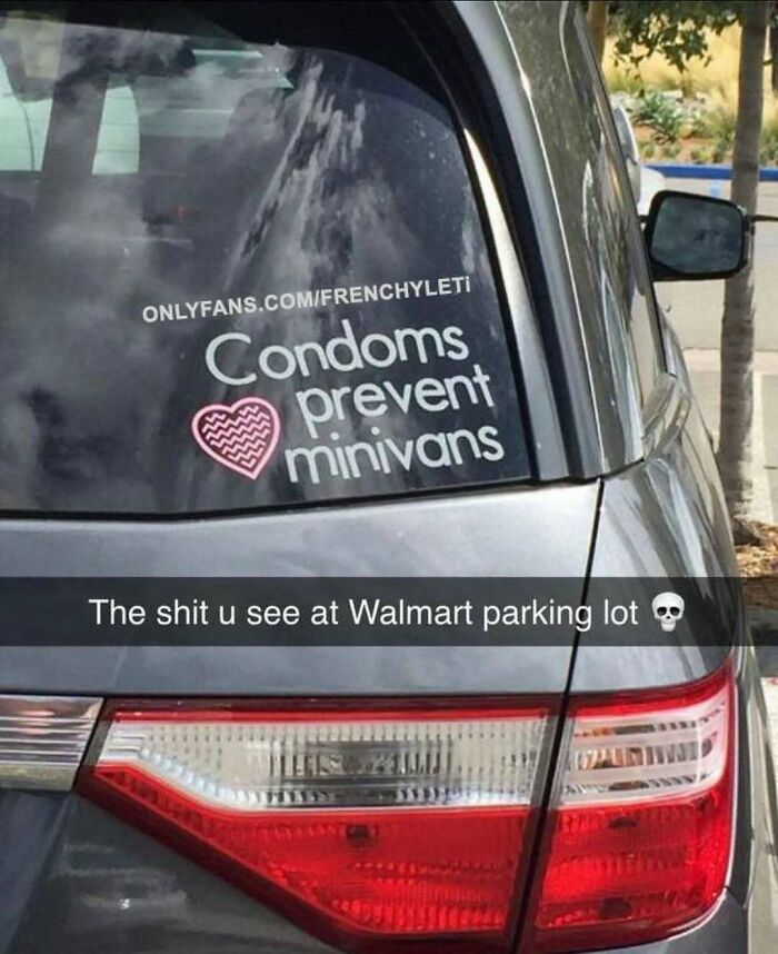 Car with humorous decal reading "Condoms prevent minivans" in a parking lot, showcasing random memes.