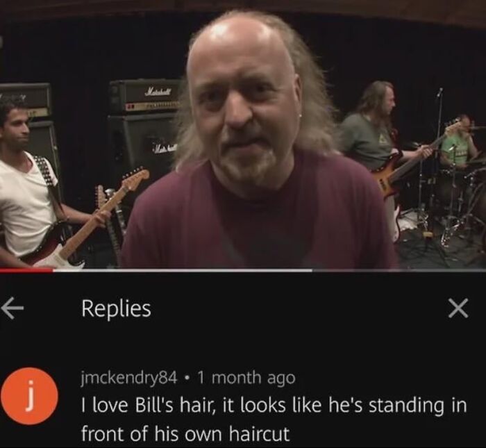 British comedian posing in a music studio; comment humorously describes his hairstyle as standing in front of his haircut.