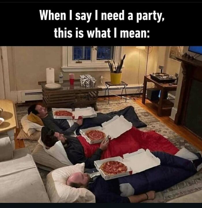 Three people lying on sleeping bags eating pizza, with the caption "When I say I need a party, this is what I mean."