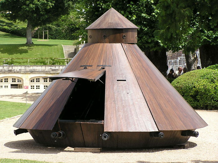 Wooden, dome-shaped historical invention on display outdoors, showcasing advanced early engineering design.