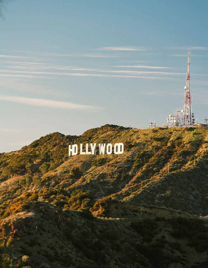 Hollywood sign on a hillside with clear sky, symbolizing beauty trends and health discussions.