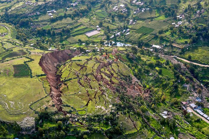 Aerial view of fascinating natural phenomena with a large landslide and cracked earth in a rural landscape.