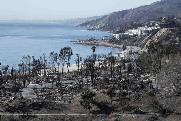 Burnt landscape by the coast in LA after fires, highlighting the aftermath of the disaster.