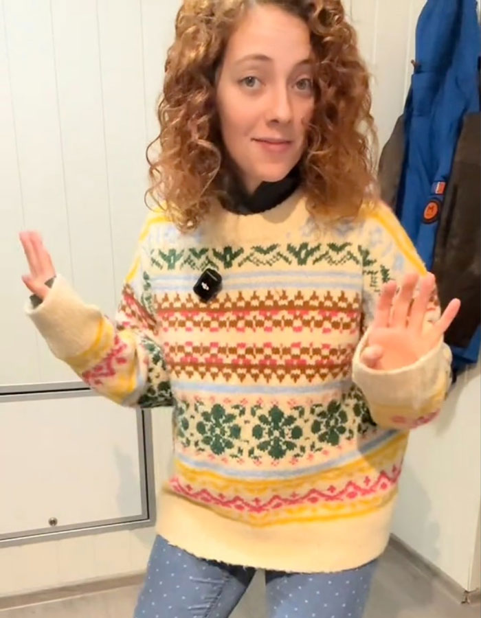 Spanish nurse in a colorful Norwegian sweater, revealing a secret to staying warm, sparking a cold weather debate.