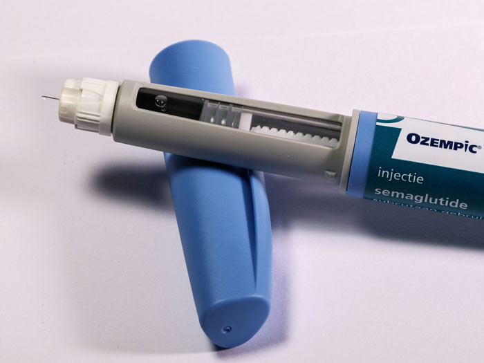 Ozempic injection pen, highlighting Hollywood beauty trends controversy.