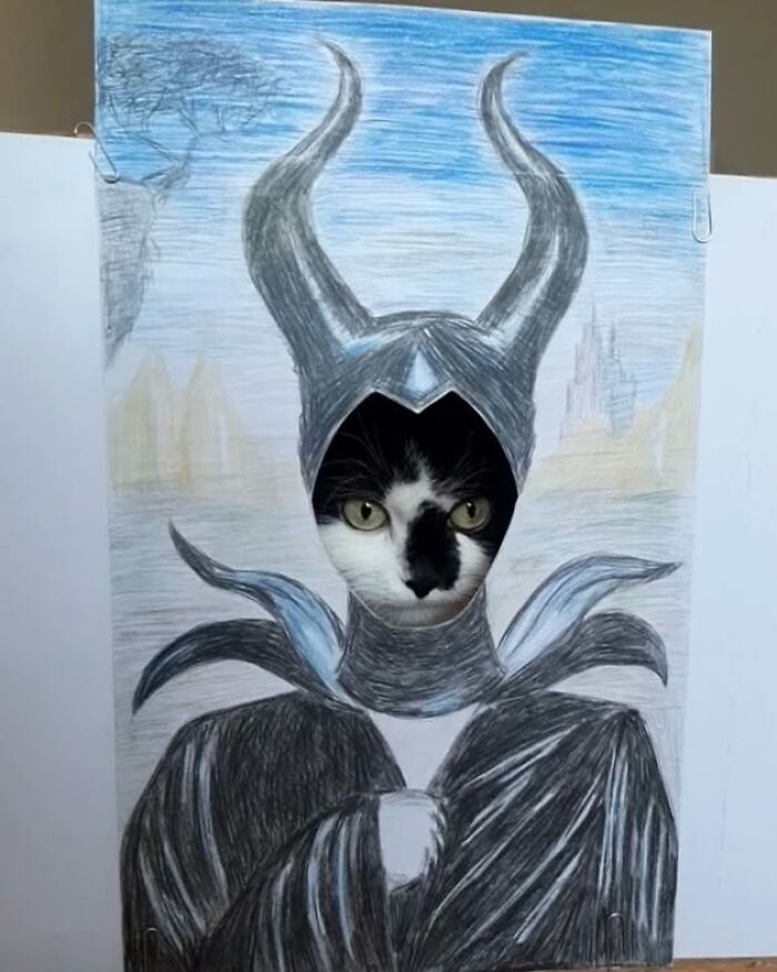 Rescue cat's face framed in drawing creating living art with Maleficent theme.