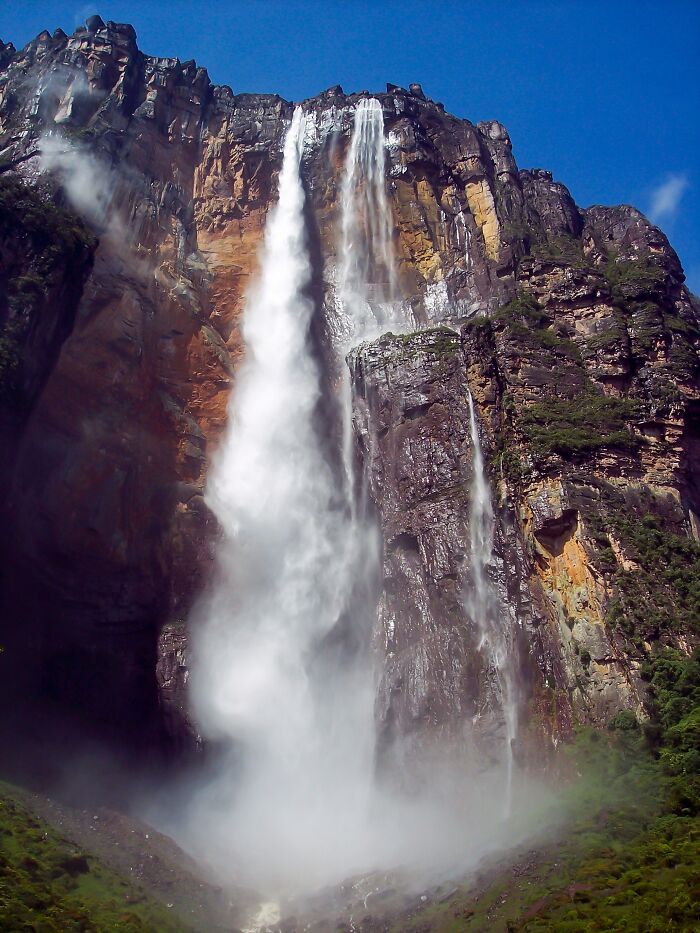 Waterfall cascading down a steep cliff, showcasing stunning natural phenomena.