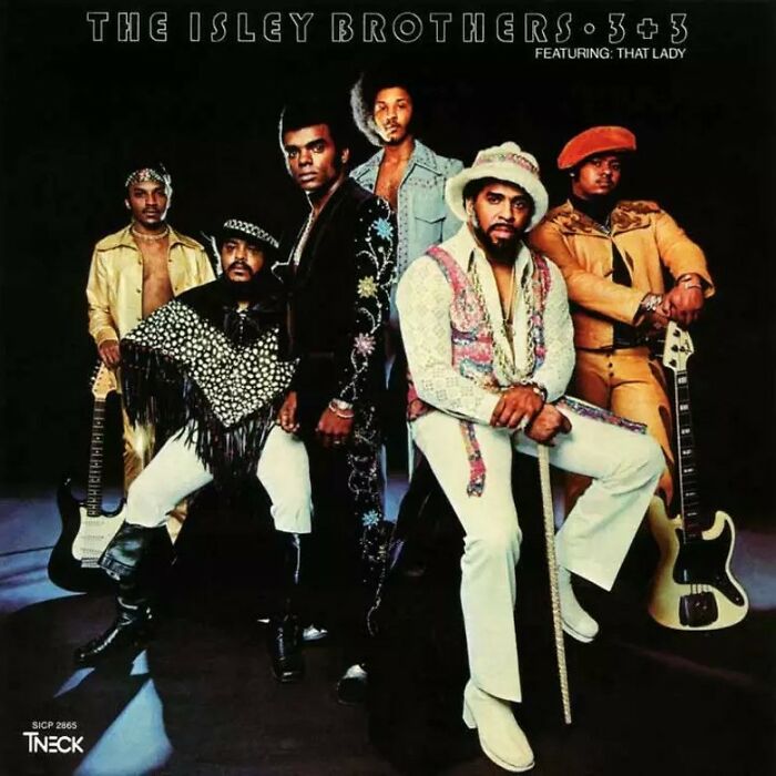 The Isley Brothers in '70s fashion with guitars, embodying classic '70s songs.