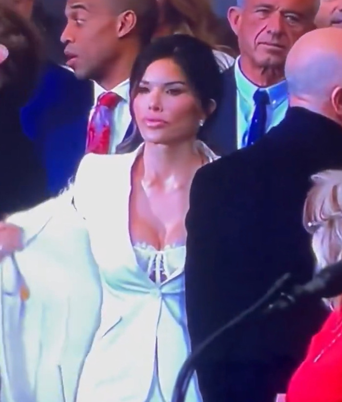 Lauren Sanchez wearing a white outfit at an event, sparking discussions about her attire.