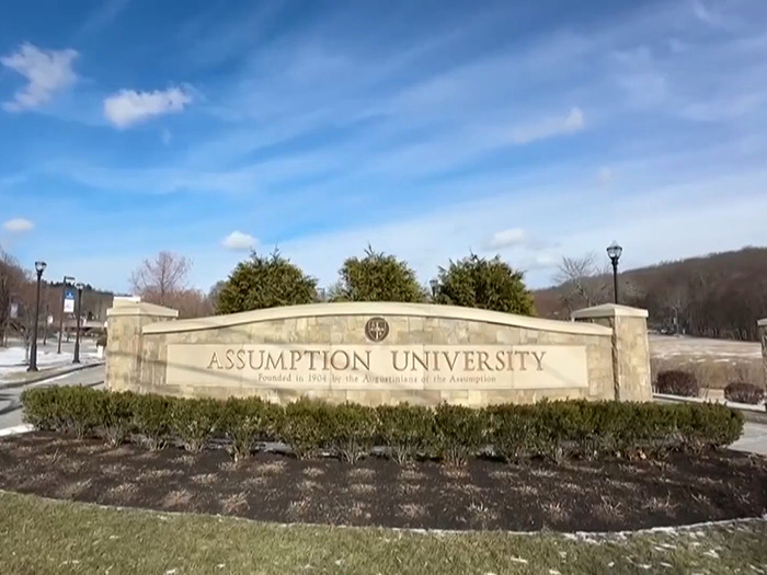 Sign of Assumption University on a clear sunny day, relevant to college students involved in TikTok-inspired incident.