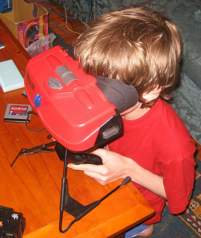 Child using an innovative retro VR headset, showcasing historical inventions ahead of their time.