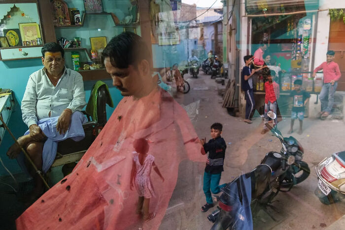 Barber shop reflection capturing daily life, a winning entry from The Artist Gallery Awards 2024.