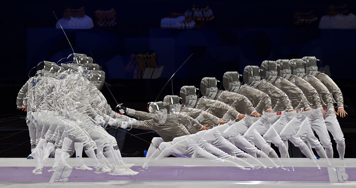 Fencers captured in dynamic motion, showcasing award-winning sports photography.