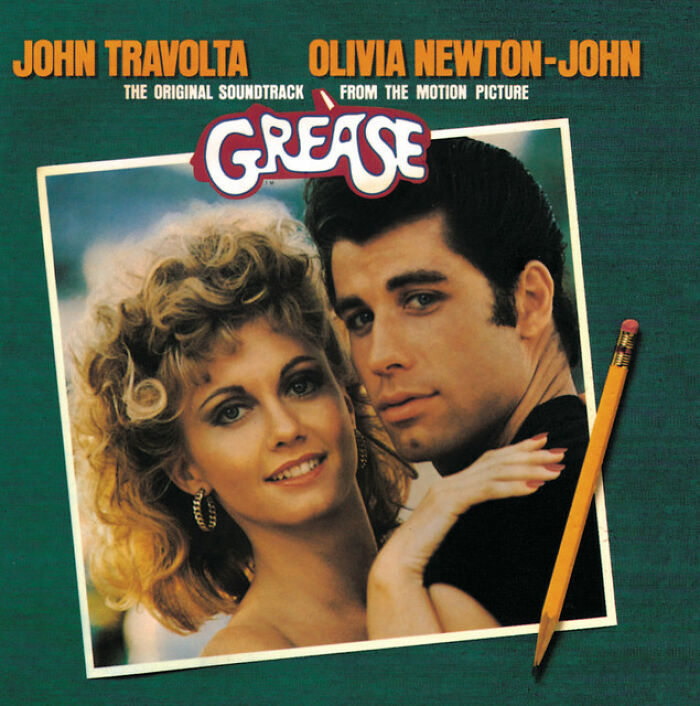 '70s song "Grease" album cover featuring a couple, capturing the iconic style and vibe of the decade's music hits.