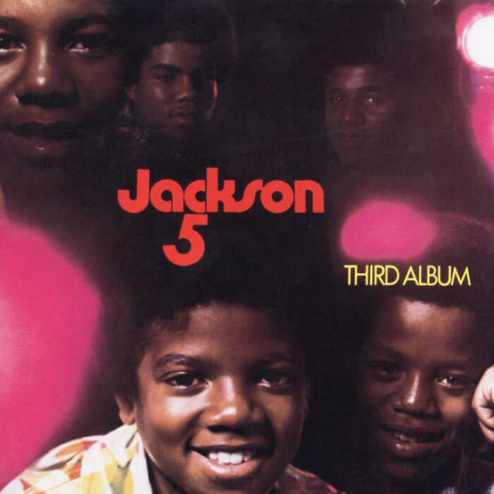 Jackson 5 album cover from the '70s, featuring members and retro lighting, symbolizing timeless music hits.