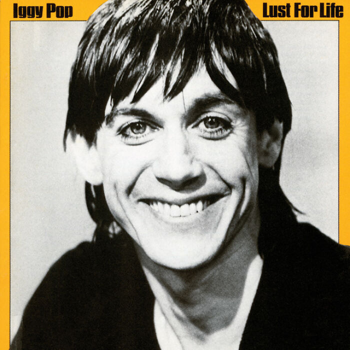 Black and white portrait of a smiling person on a classic album cover from the '70s.