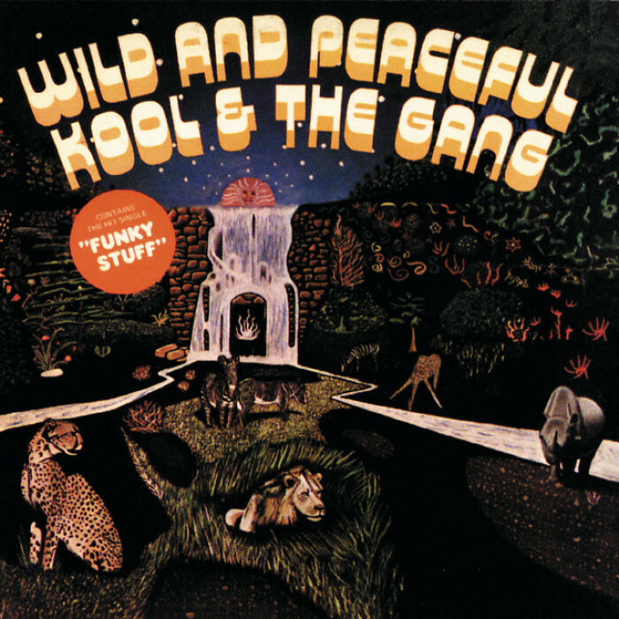 Album cover of "Wild and Peaceful" by Kool & The Gang, featuring '70s style art and animals in a vibrant scene.