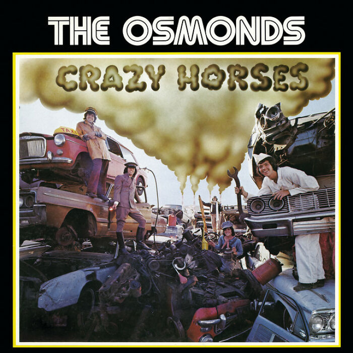 '70s song album cover featuring The Osmonds standing in a junkyard with "Crazy Horses" title above them.